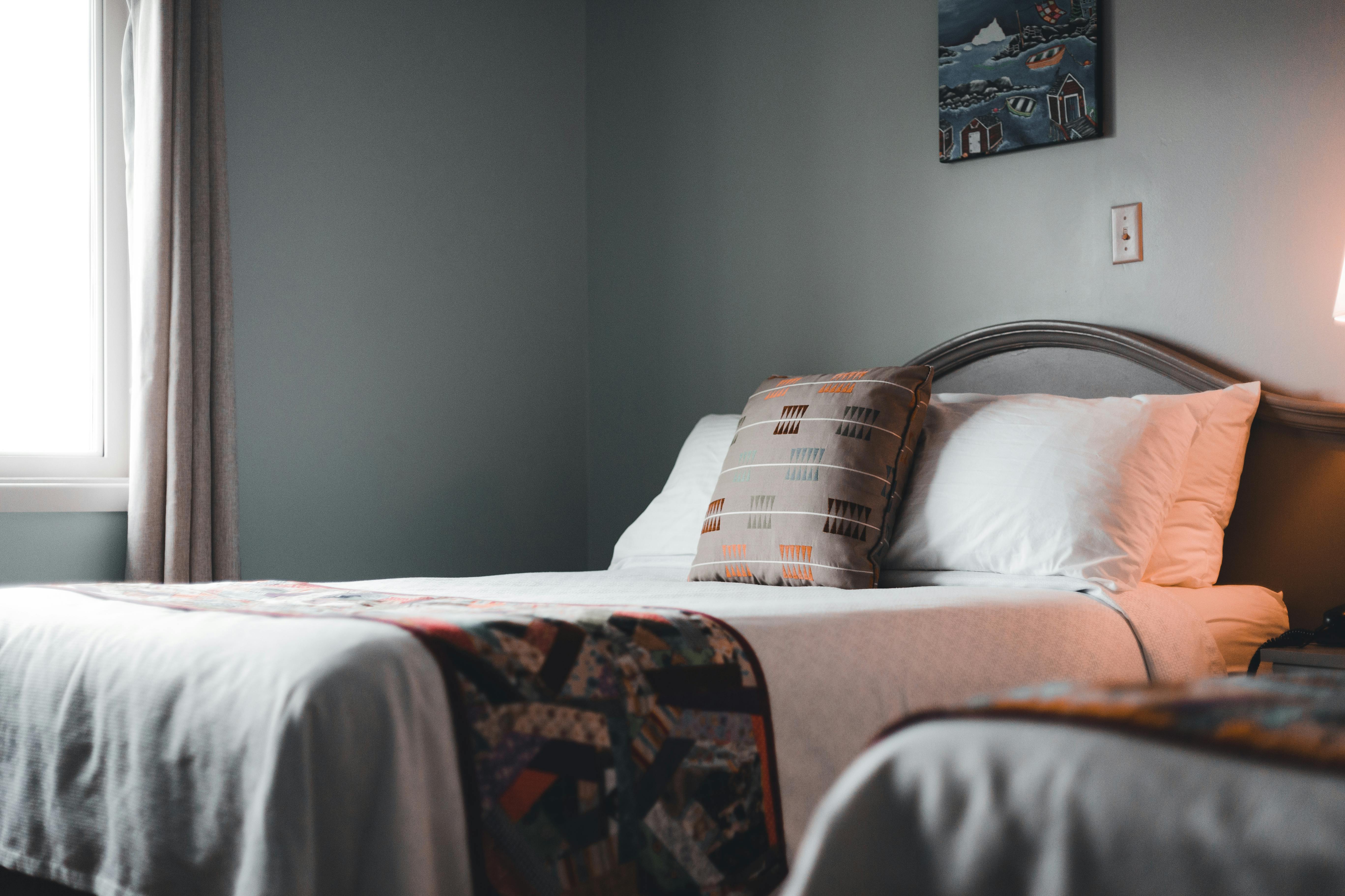 Fresh bed linens and a cleaned bedroom after service